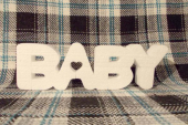 Слово "BABY" из пенопласта